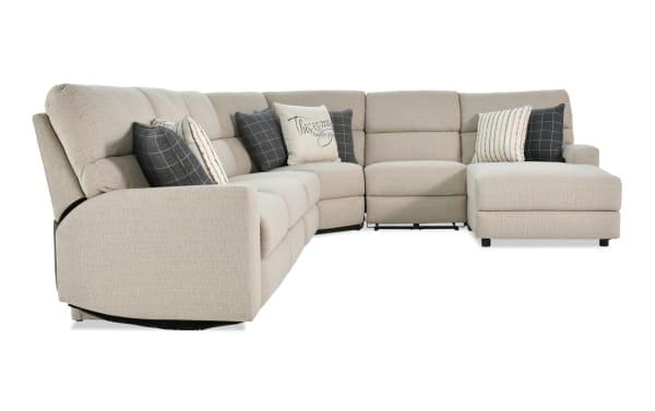 Modern Farmhouse beige 5-piece right arm facing fabric polyester sectional with power reclining seats, sleeper chaise, power headrests, and accent pillows.
