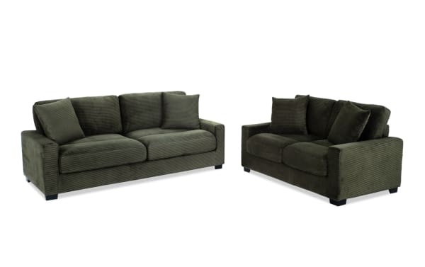 Aspen Forest 86'' sofa and 61'' loveseat set in green polyester fabric, transitional style with plush cushions and accent pillows, durable plywood frame.