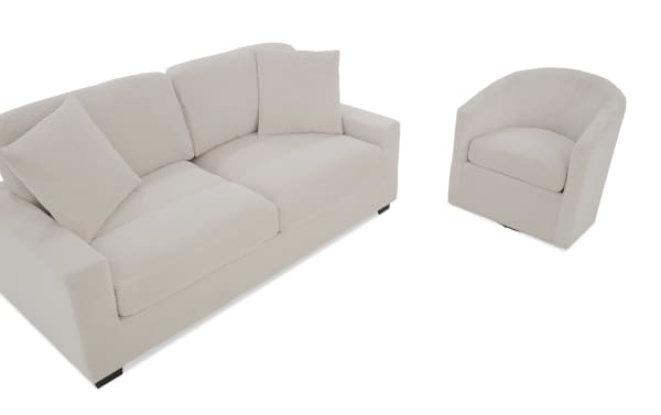 Beige corduroy fabric sofa and matching armchair set with cushioned seats and pillows, modern living room furniture design.
