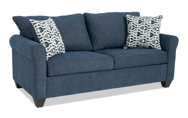 Slumber Navy 80'' transitional sleeper sofa with plush navy polyester upholstery, patterned accent pillows, and queen gel memory foam mattress.