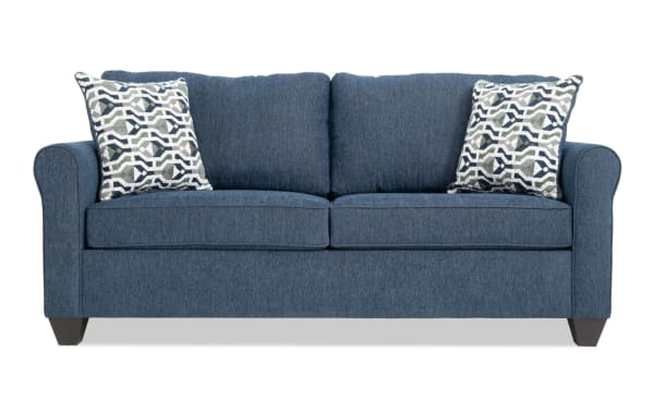 Slumber Navy 80'' transitional sleeper sofa in blue polyester fabric with plush cushions, patterned accent pillows, and a queen cooling gel memory foam mattress.