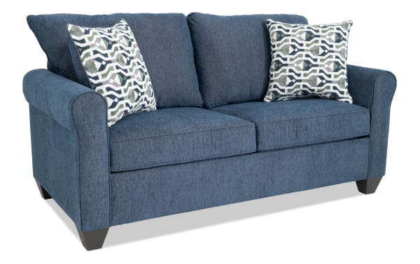 Slumber Navy 72'' transitional sleeper sofa with plush polyester fabric, patterned accent pillows, and a full cooling memory foam mattress.