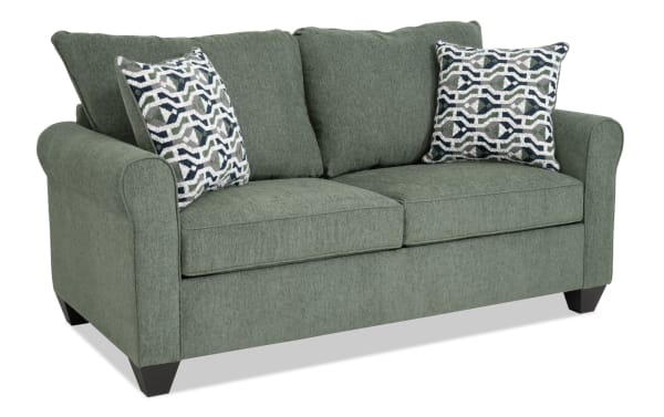 Slumber Green 72" transitional sleeper sofa in green polyester fabric with plush cushions, patterned accent pillows, and full gel memory foam mattress.