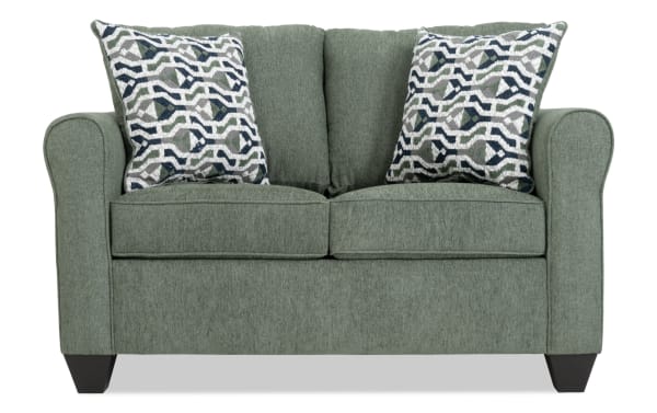 Slumber Green 56'' Sleeper Sofa in green polyester fabric with transitional style, patterned accent pillows, and cooling twin memory foam mattress.