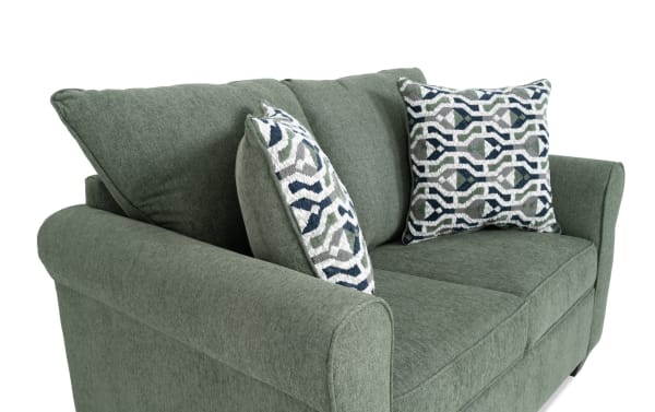 Transitional Slumber Green 56'' sleeper sofa with plush polyester fabric, patterned accent pillows, and cooling twin pull-out mattress.