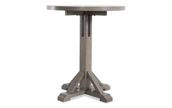 Iris Light Gray Adjustable Height Round Dining Table with transitional style, MDF and oak veneer construction, and a sturdy pedestal base.