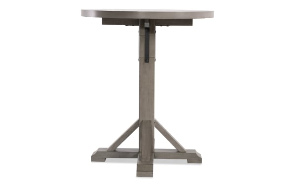 Round Iris Light Gray adjustable height dining table with a sturdy pedestal base, crafted from MDF, poplar solids, and oak veneers in a transitional style.