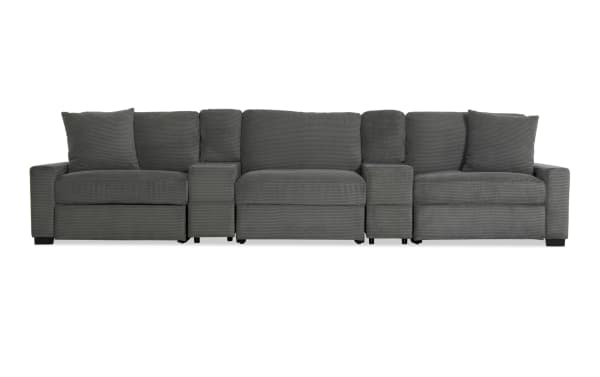 Modern dark gray fabric sectional sofa with three seats, wide armrests, and plush back cushions, ideal for living room seating.