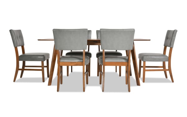 Bettie 7 Piece Walnut & Charcoal Faux Leather Dining Set with mid-century modern style, gray faux leather upholstery, flared walnut legs, and memory foam seats.