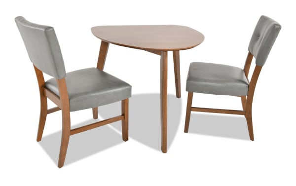 Bettie 3 Piece Walnut & Charcoal Faux Leather Upholstered Triangle Dining Set with mid-century modern MDF table and flared leg chairs featuring gray faux leather seats.