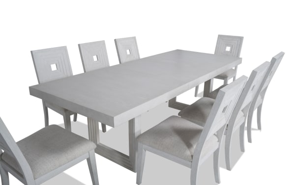 Contemporary Infinity 9 Piece White Upholstered Dining Set with extendable MDF, rubberwood, oak veneers table and polyester fabric chairs.