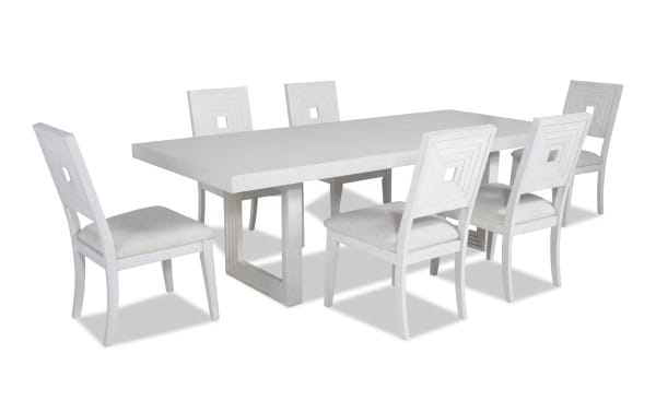Contemporary Infinity 7 Piece White Upholstered Dining Set with extendable MDF, rubberwood, oak veneer table and polyester fabric Bob-O-Pedic stuffed panel back chairs.