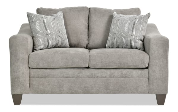 Lucas Charcoal 61'' loveseat in gray polyester fabric with transitional style, slope arms, plush cushions, and two patterned accent pillows.