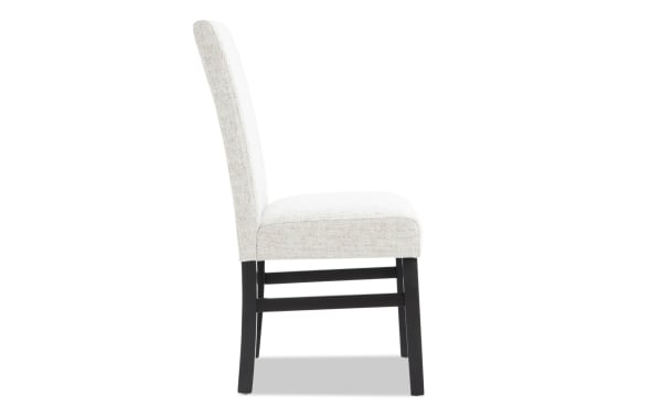Contemporary Luna Dining upholstered dining chair in gray polyester fabric with solid back and sturdy black MDF frame, plush cushioned seat.