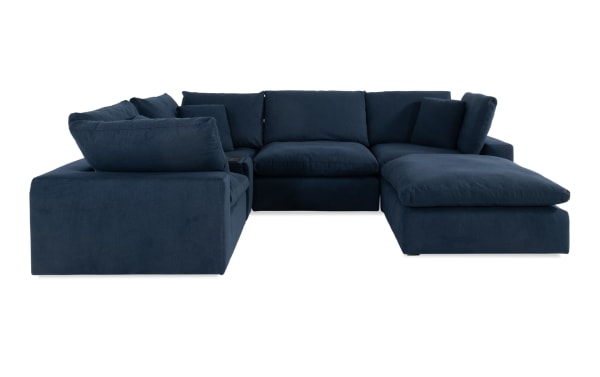 Dream Navy 131'' 6-piece modular sectional sofa in navy blue polyester fabric with 3 corners, armless chair, console, and ottoman.