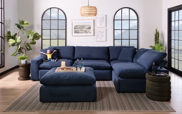 Dream Navy 131'' 6 Piece Modular Sectional in navy blue polyester fabric with USB/USB-C ports, reversible cushions, and transitional style.