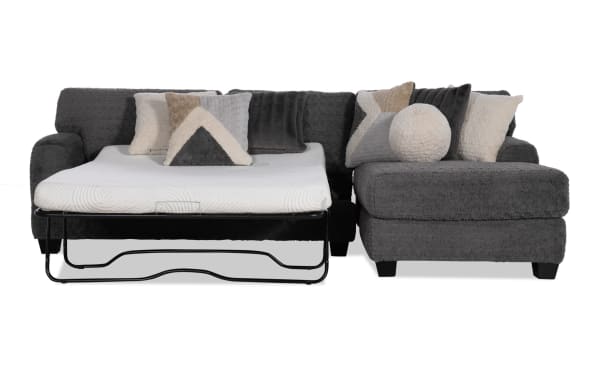 Doodle Gray 114'' 2-piece right arm facing sleeper chaise sectional in gray polyester fabric, transitional style with gel mattress and accent pillows.