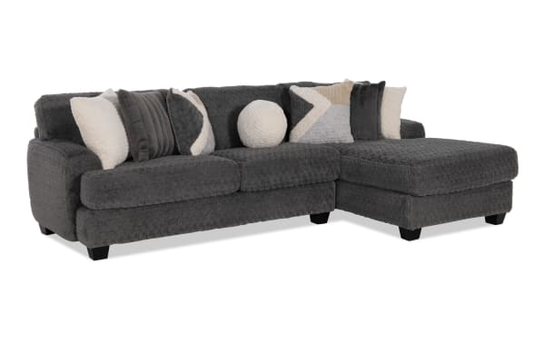 Doodle Gray 114'' 2-piece right arm facing sleeper chaise sectional in gray polyester fabric with transitional style, memory foam seating, and accent pillows.