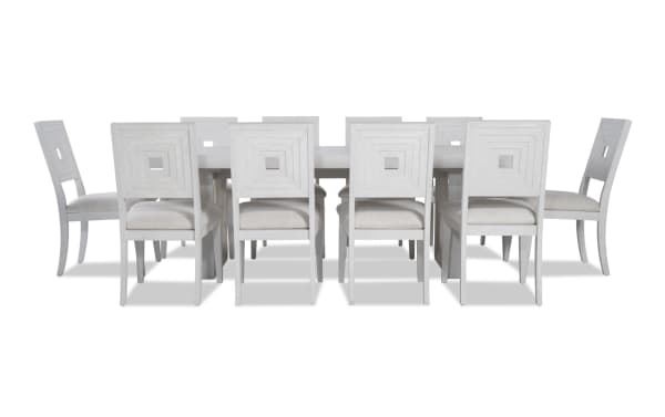 Contemporary Infinity 11 Piece White Upholstered Dining Set with extendable MDF, rubberwood, oak veneer table and polyester fabric chairs.