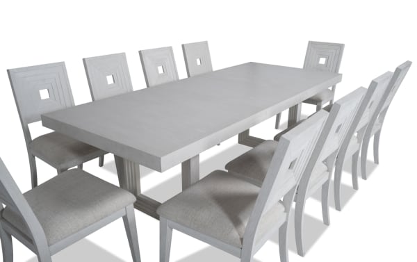 Contemporary Infinity 11 Piece White Upholstered Dining Set with MDF, rubberwood, oak veneers, and polyester fabric chairs featuring extendable table and panel back design.