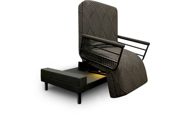 Freedom Twin XL Lift Bed with black patterned upholstery, metal armrests, and a base that lifts and rotates 90° to assist standing.