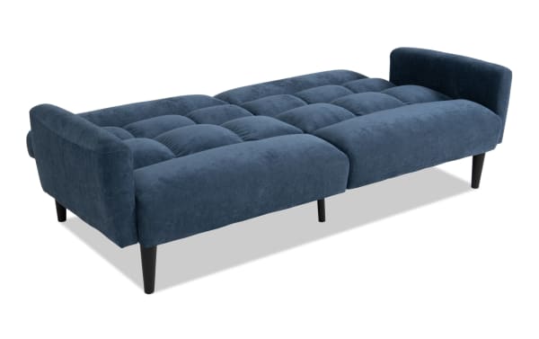Harmony Navy Futon in transitional style with navy polyester fabric upholstery, padded seating, and low armrests, shown in sofa bed position.