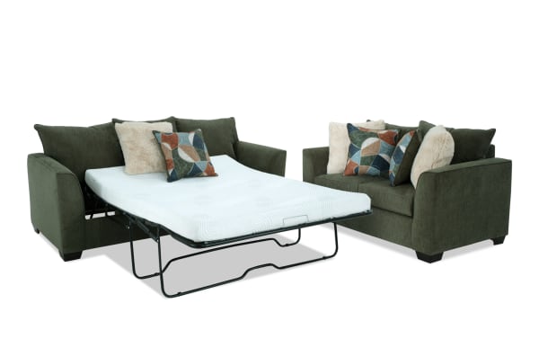 Brynn Green 88'' transitional sleeper sofa with queen gel memory foam mattress and 64'' loveseat, upholstered in soft green polyester fabric with patterned accent pillows.