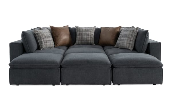 Infinity Thunder Blue 147'' 9-piece modular sectional with 4 ottomans, 3 armless chairs, 2 corners in blue polyester fabric. Transitional style with Bob-O-Pedic® stuffed seats and feather-blend accent pillows.