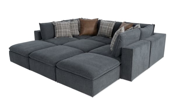 Transitional Infinity Thunder Blue 147'' 9-piece modular sectional with 4 ottomans, 3 armless chairs, 2 corners, polyester fabric upholstery, and feather-blend pillows.