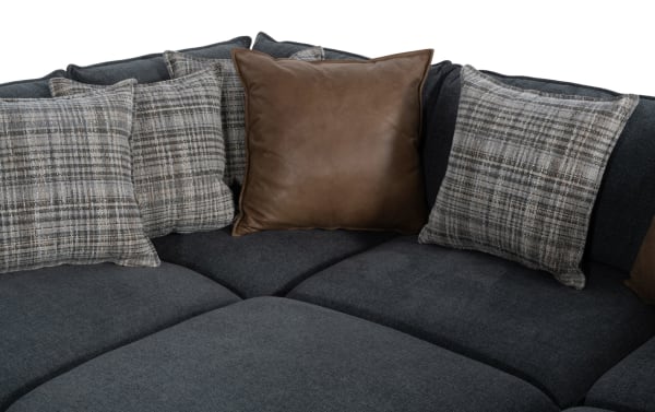 Transitional Infinity Thunder Blue 9-piece modular sectional with blue polyester fabric, feather-blend plaid and leather accent pillows, and removable cushions.