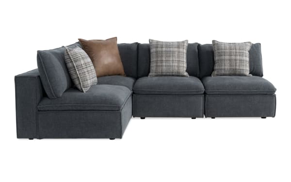 Infinity Thunder Blue 109'' 4-piece modular sectional in transitional style, blue polyester fabric with Bob-O-Pedic® seats, feather-blend pillows, and Siberian pine frame.