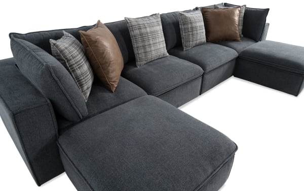 Infinity Thunder Blue 150'' 6-piece modular sectional in blue polyester fabric, featuring 2 armless chairs, 2 corners, 2 ottomans, feather-blend pillows, and removable cushions. Transitional style with a sturdy Siberian pine frame and no-sag sinuous seating for lasting comfort.