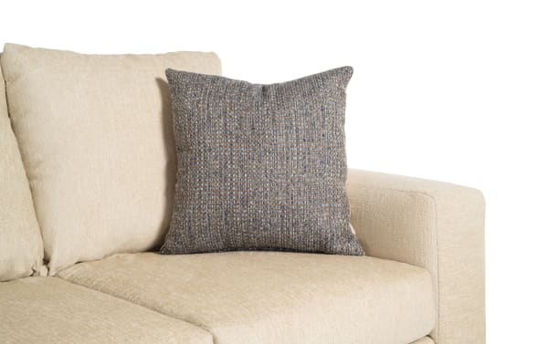 Beige Claudia 84'' transitional sofa upholstered in polyester fabric with plush cushions and a textured gray accent pillow for comfort and style.