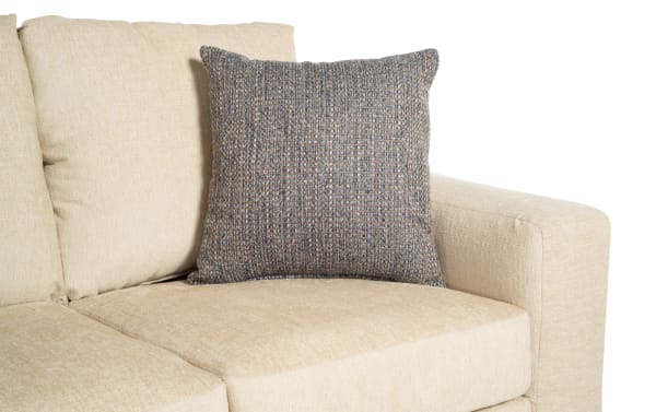 Beige Claudia 62'' transitional loveseat upholstered in soft polyester fabric with two matching accent pillows for added comfort and style.