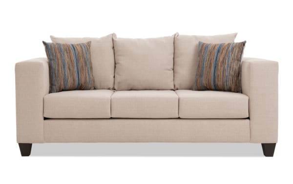 Haley 84'' beige sofa with polyester fabric upholstery, transitional style, three-seat cushions, and two striped accent pillows for contemporary living rooms.