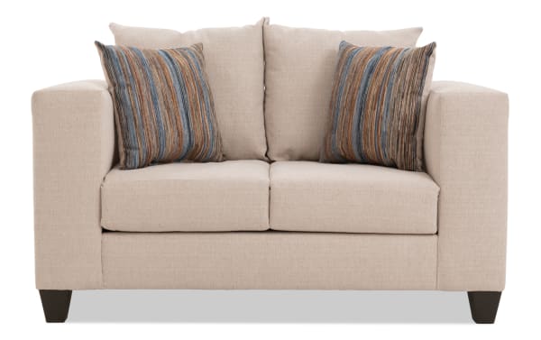Haley 61'' beige loveseat with polyester fabric upholstery, transitional style, includes two striped accent pillows, sturdy block legs.