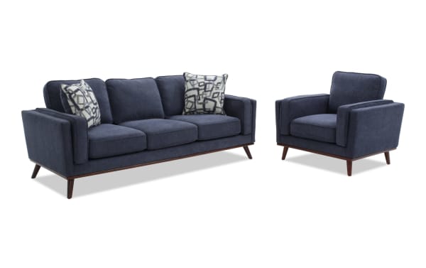 Tribeca Navy 90'' Sofa & Chair set in blue polyester fabric, mid-century modern style with tapered wood legs, memory foam cushions, and patterned accent pillows.