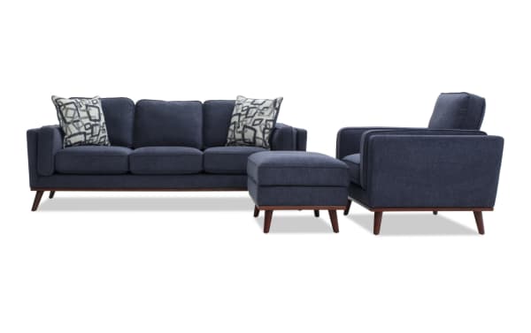 Tribeca Navy 90'' Sofa, Chair & Storage Ottoman set in mid-century modern style with navy polyester fabric, memory foam cushions, and hidden storage ottoman.