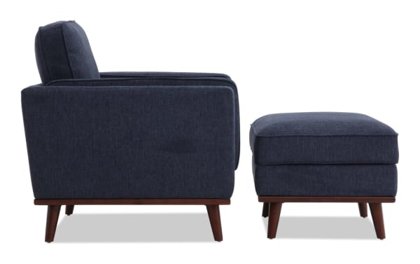 Tribeca Navy Chair & Storage Ottoman set in mid-century modern style, featuring navy polyester fabric, tapered wooden legs, memory foam cushioning, and hidden ottoman storage.