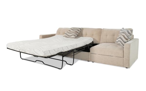 Beige Modular Bob® 124" 2-piece left arm facing contemporary sectional sofa with polyester fabric upholstery, built-in storage, and queen-size pull-out sleeper with cooling gel memory foam mattress.