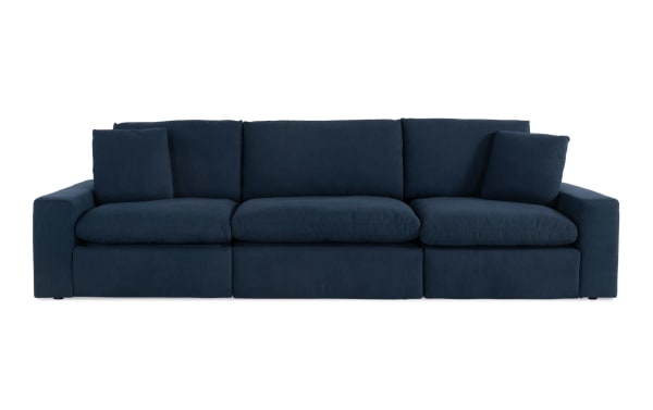 Dream Navy 131'' Power Reclining Modular Sofa in navy blue polyester fabric with 3 power recliners, power headrests, reversible cushions, and accent pillows. Transitional style from the Dream collection.