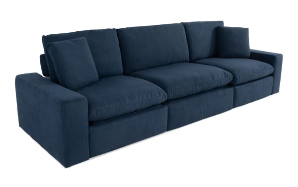 Dream Navy 131'' Power Reclining Modular Sofa with Power Headrest, 3 recliners, navy blue polyester fabric, transitional style, reversible cushions, and accent pillows.