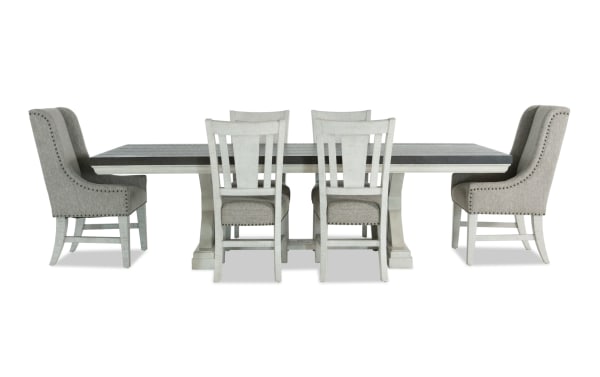 Beaumont 7 Piece Transitional Dining Set with beige upholstered polyester fabric chairs, pine solid and veneer extendable table with storage drawers.