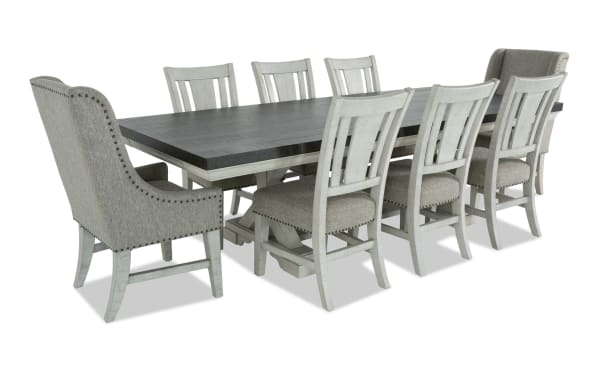 Beaumont 9 Piece Beige Upholstered Extendable Dining Set with pine solids, polyester fabric, nailhead trim, memory foam chairs, and felt-lined storage drawers.