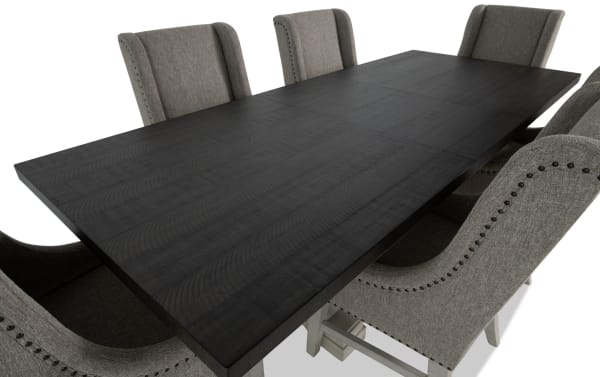 Beaumont 7 Piece Beige Upholstered Extendable Dining Set with pine solids, fabric polyester chairs featuring nailhead trim and memory foam cushions.