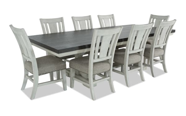 Beaumont 9 Piece Transitional Dining Set with beige polyester upholstered memory foam chairs, white pine solids frame, and extendable brown pine veneer table with felt-lined storage drawers.