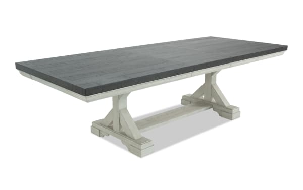 Beaumont White & Brown Extendable Storage Dining Table from Beaumont Dining collection, transitional style with pine solids, veneer, MDF, featuring a dark brown rectangular top and white trestle base with felt-lined storage drawers.