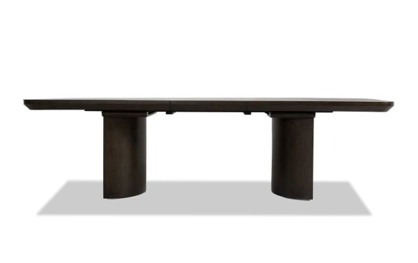 Luxe Brown Extendable Dining Table from Luxe Dining collection, featuring a contemporary oak veneer top with rubberwood solid cylindrical legs, extends to 108 inches.