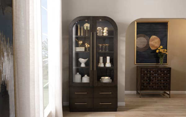Luxe Brown 4 Drawer China Cabinet from Luxe Dining collection, featuring contemporary rounded edges, LED lighting, tempered glass doors, and rubberwood with oak veneer. Four spacious drawers provide ample storage in rich brown finish.