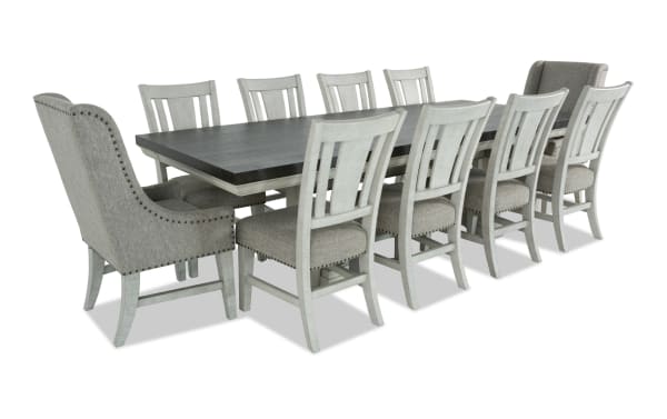 Beaumont 11-piece beige transitional dining set with extendable pine wood table and upholstered polyester fabric chairs featuring nailhead trim and storage drawers.